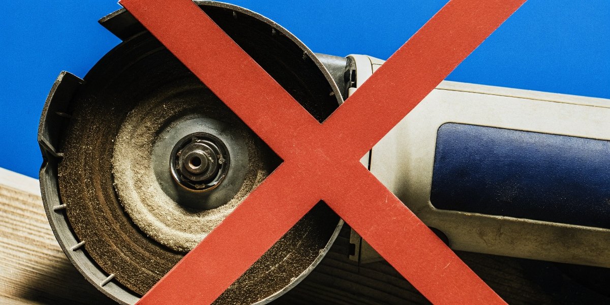 A red X over an image of an angle grinder with its safety guard removed