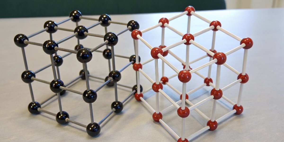 A diagram showing the crystal lattice structure of Cubic Boron Nitride next to the crystal structure of diamond.