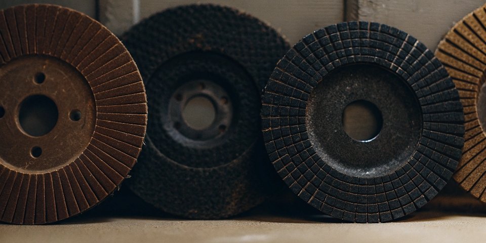 An assortment of angle grinder discs for cutting, grinding, and polishing