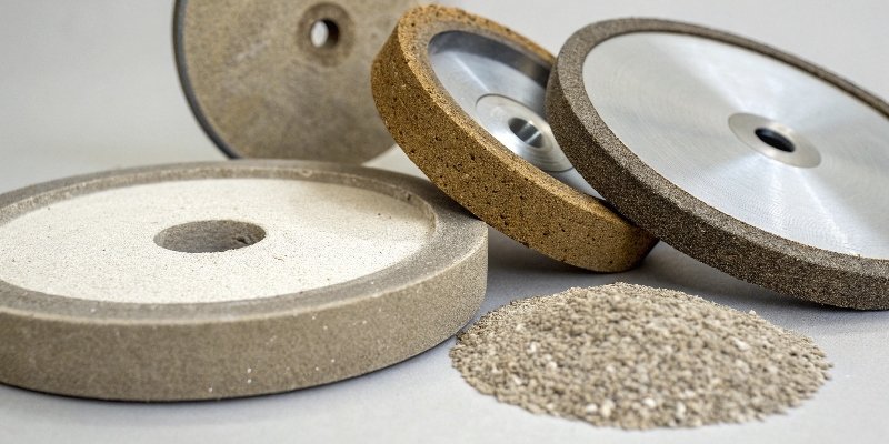 A visual comparison of coarse, medium, and fine grit sizes on a CBN wheel