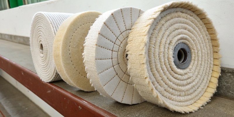 a lineup of different buffing wheels, including sisal, stitched cotton, and loose flannel